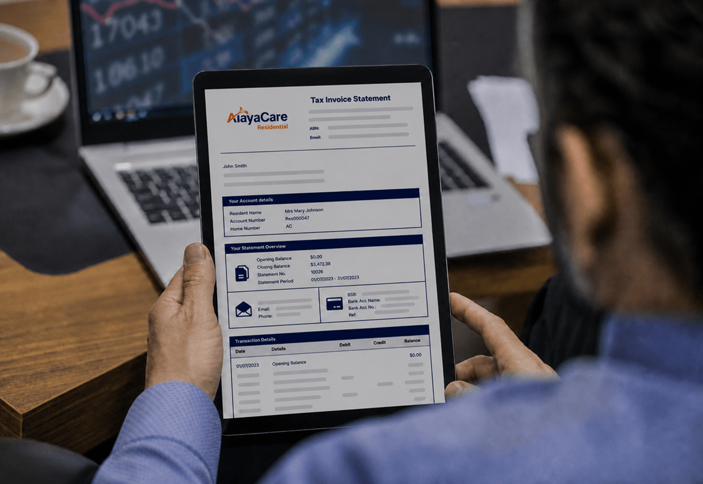 Person reviewing an AlayaCare tax invoice statement with account and transaction details on a tablet