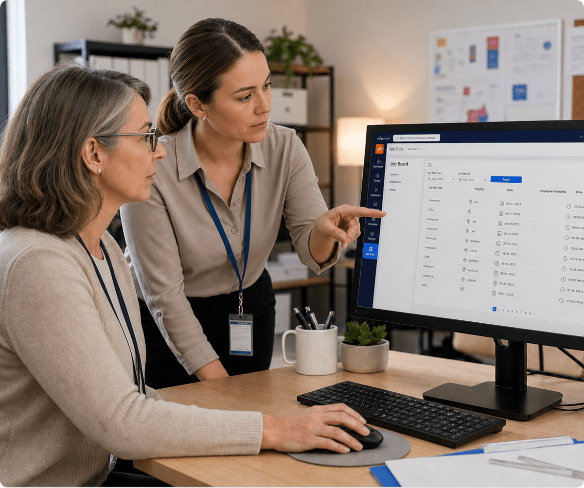 Office workers reviewing an AlayaCare Job Board screen listing homecare visits with dates and employee availability